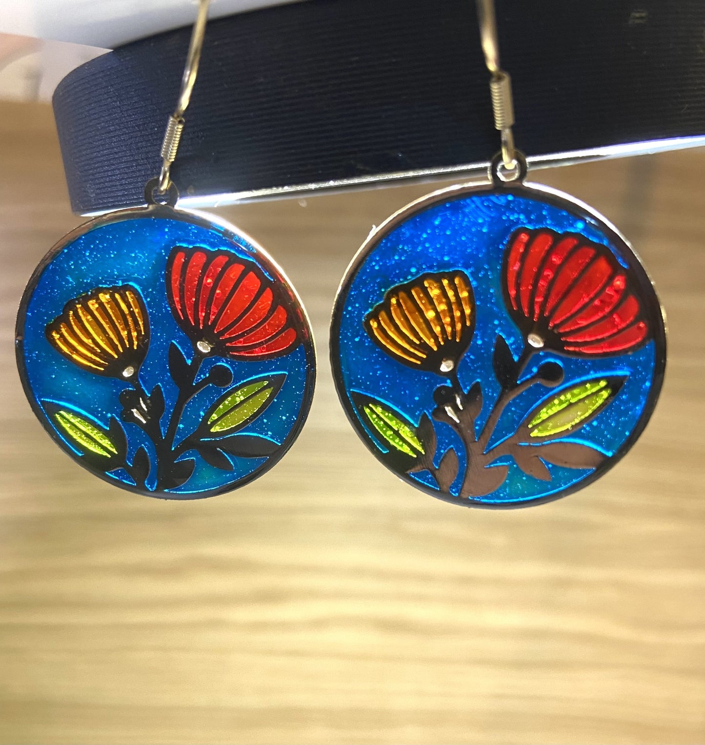 Red & orange resin flower- blue background
