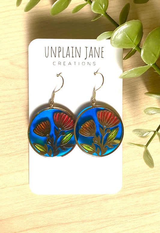Red & orange resin flower- blue background