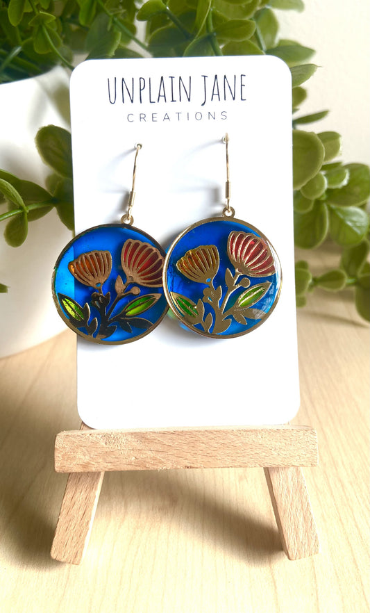 Red & orange resin flower- blue background