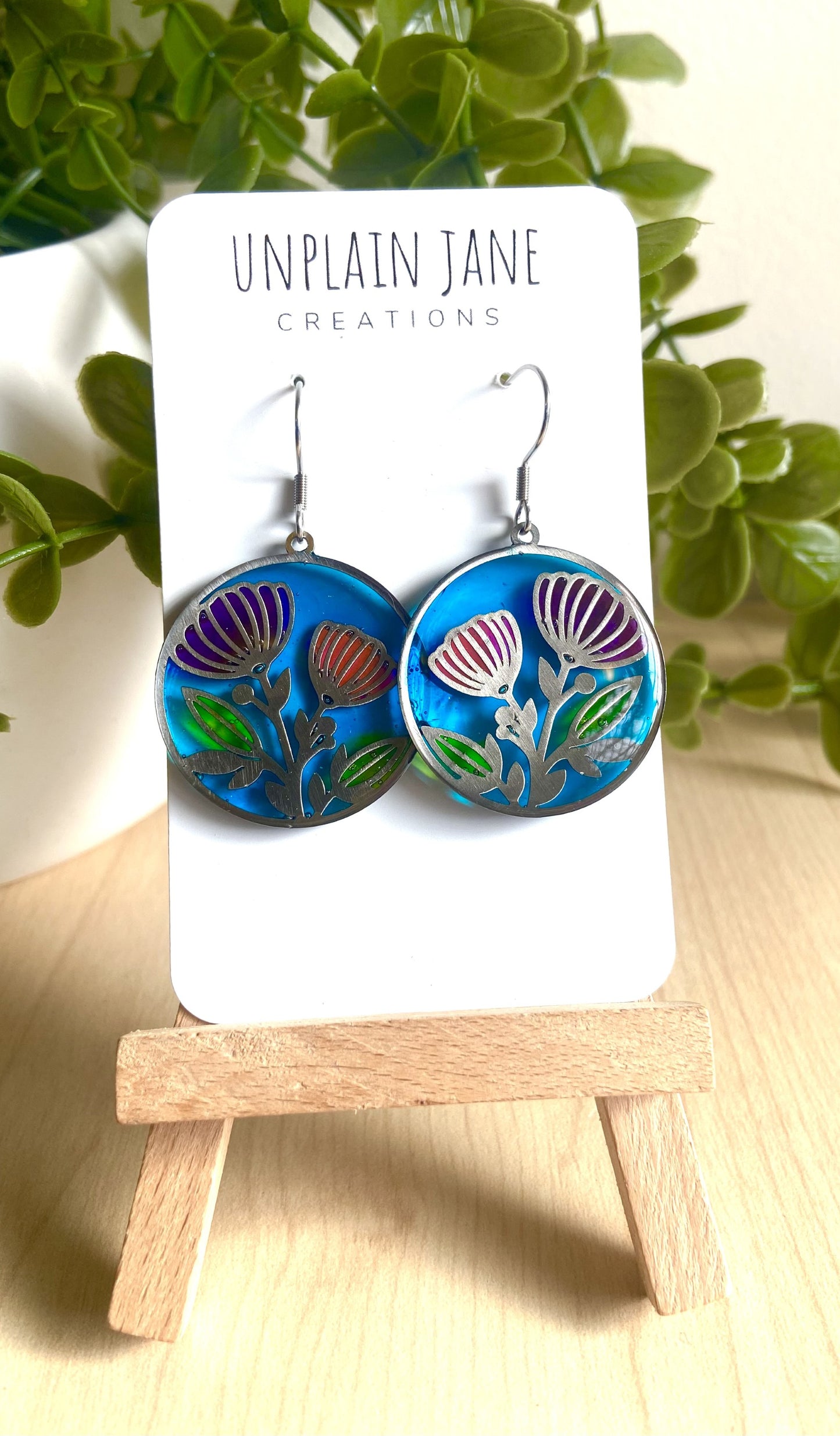 Pink & purple resin flower with blue background